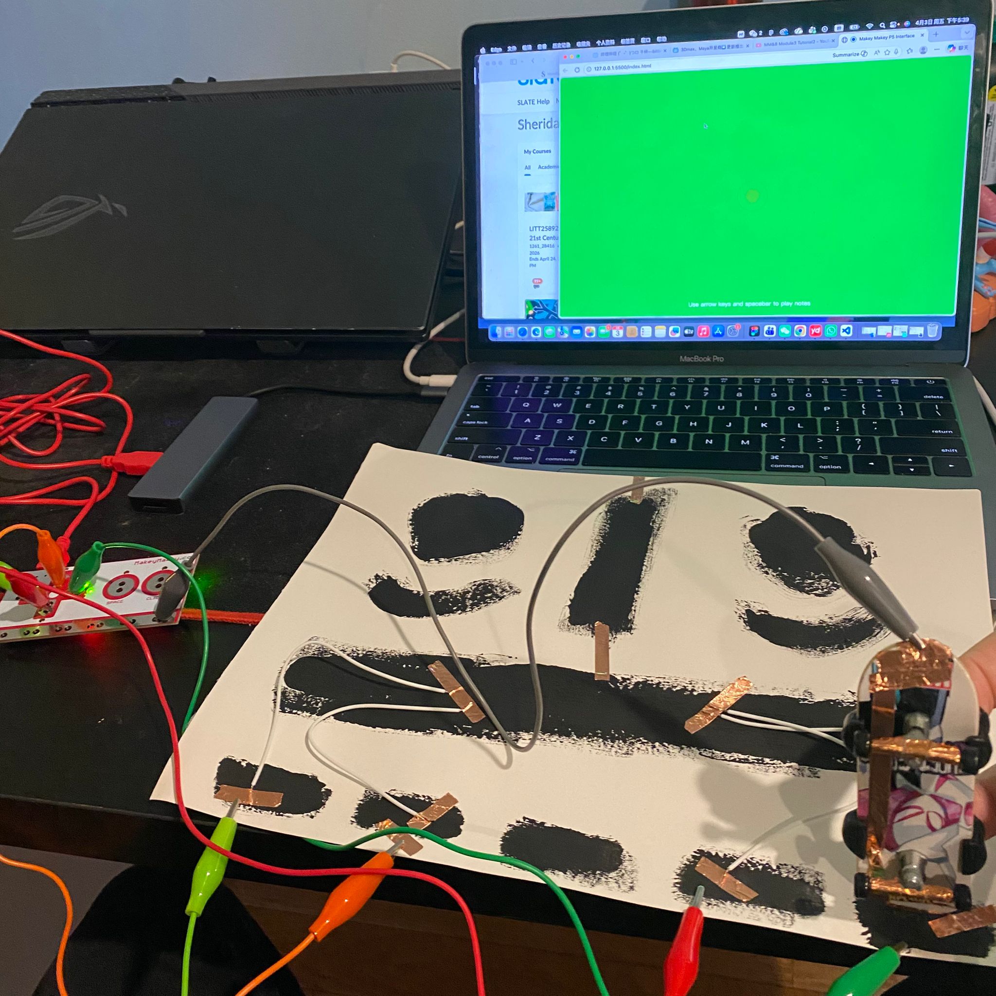 I attempted to touch different sections of the conductive paint to observe the changes.
