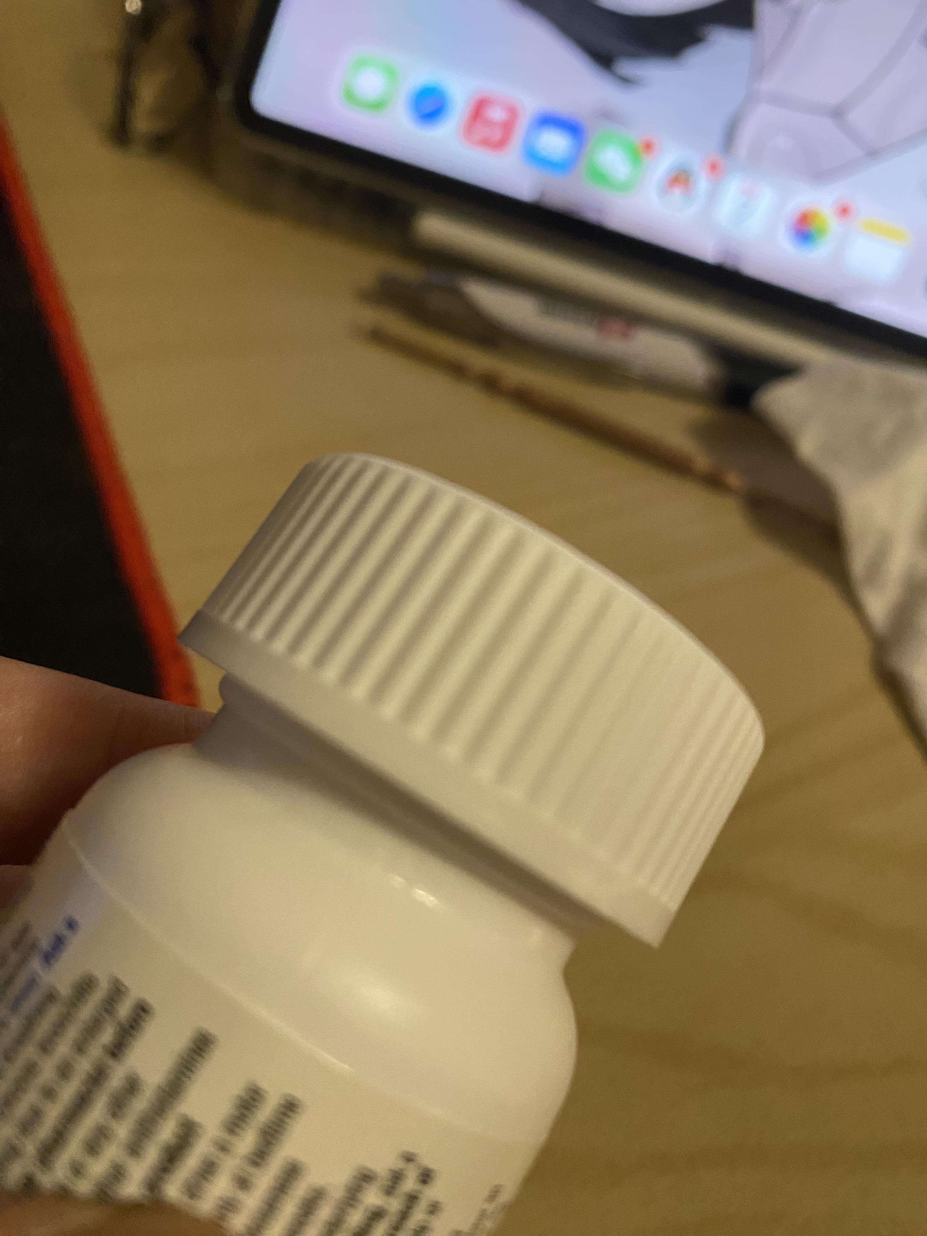 A close-up picture of a medicine bottle